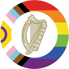 Logo for the Department of Children, Equality, Integration and Youth. A gold harp surrounded by a circle of rainbow colours.